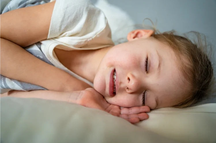A little girl grinding her teeth in sleep