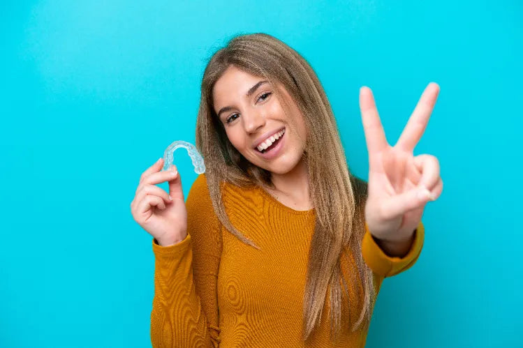 Woman holding her hand with both hands, appearing anxious and in pain from an unbearable headache