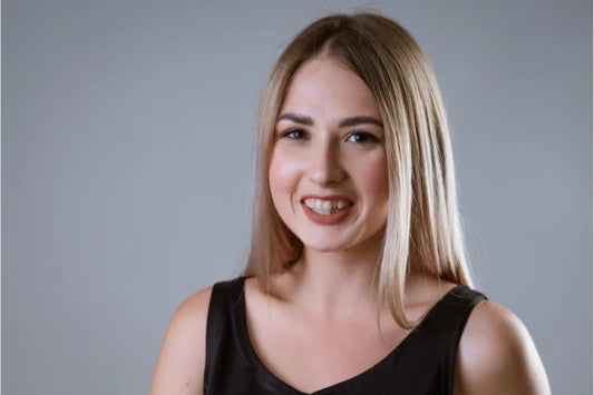 A beautiful girl smiles confidently with her crooked teeth
