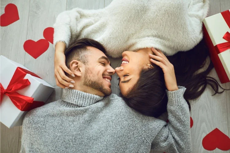 A young couple smiling with perfect straight teeth