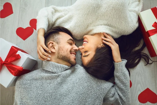 A young couple smiling with perfect straight teeth