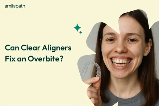 A girl with an overbite holding clear aligners in her hand