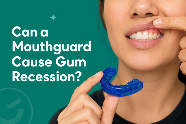 A woman holding a mouthguard while showing her gumline.