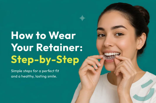 A woman placing a clear retainer on her teeth.
