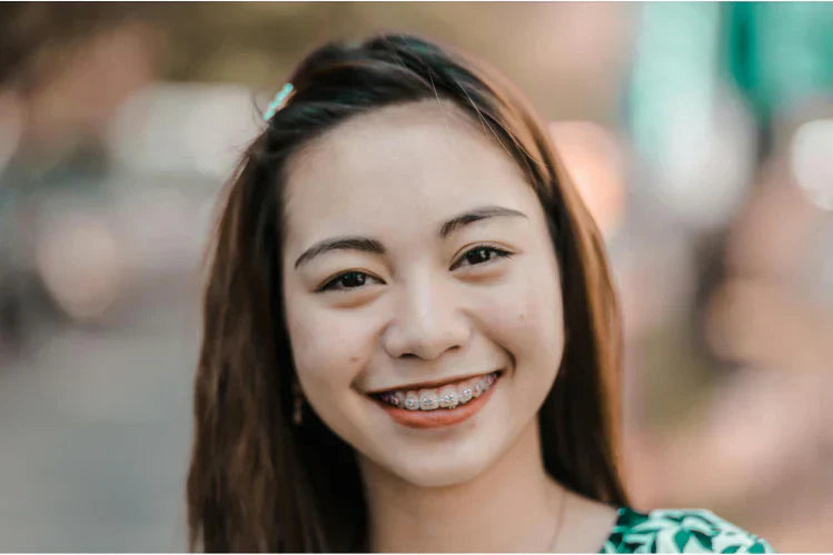 A girl is wearing braces