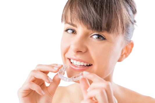 A girl applying clear aligners.