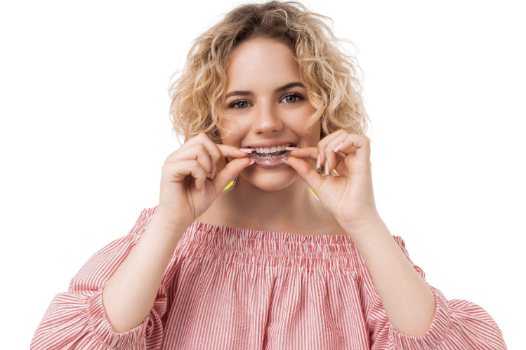 A woman wearing aligners