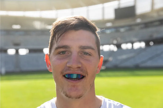 Rugby player wearing a sports mouthguard.