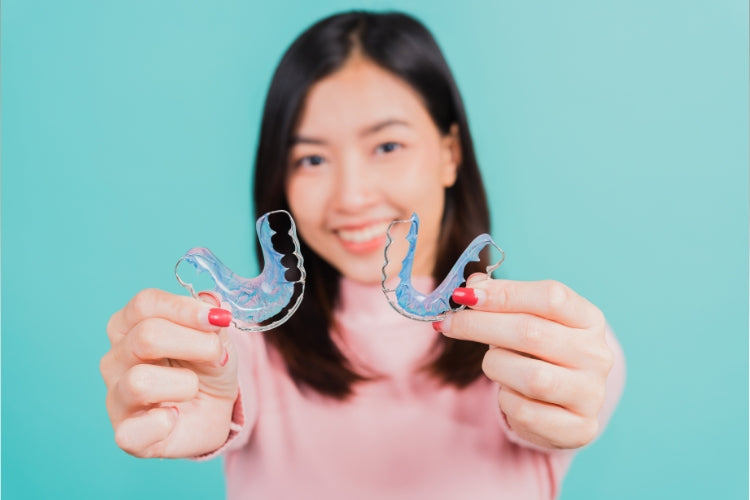 A picture of a woman with Hawley retainers