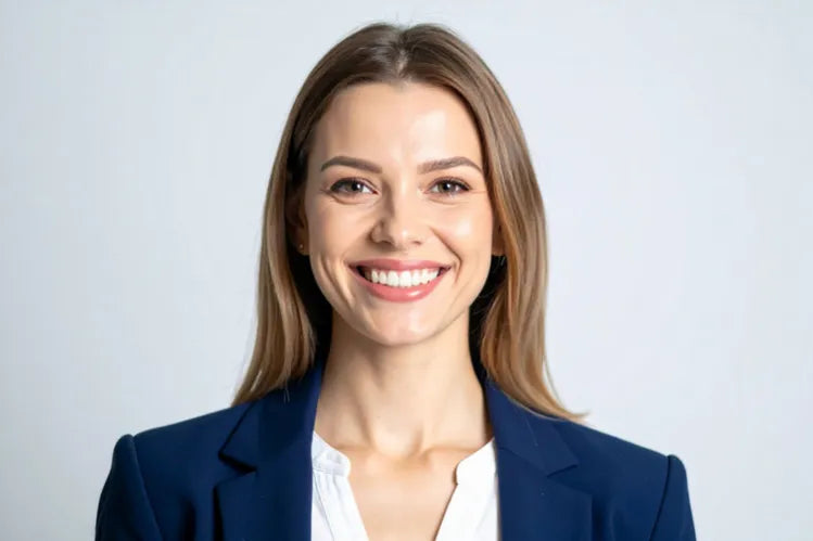  A woman smiling after achieving a picture-perfect smile.