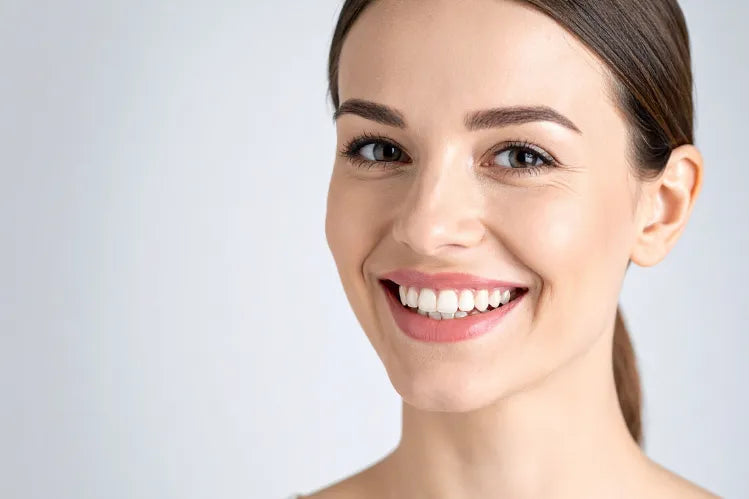 A girl flaunting her perfectly straighter and brighter smile.