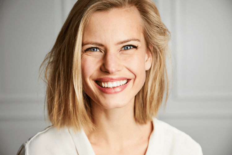  Woman wearing clear aligners