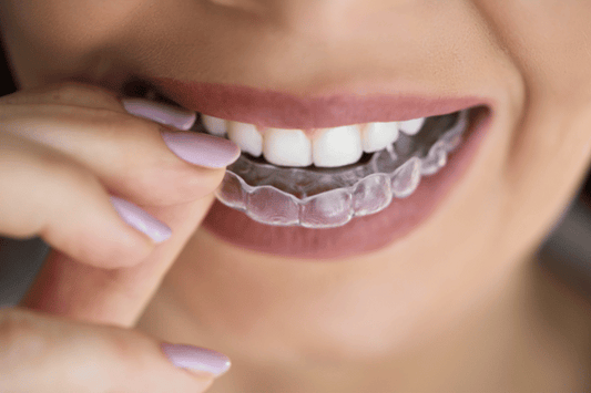 woman with aligners