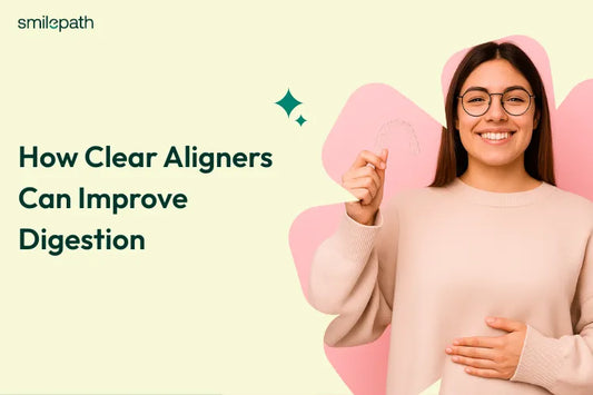 A girl putting one hand on her stomach and holding clear aligner on other hand